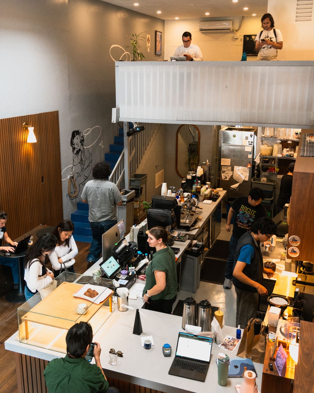 Ondo in LA with people ordering coffees and sitting upstairs remote working