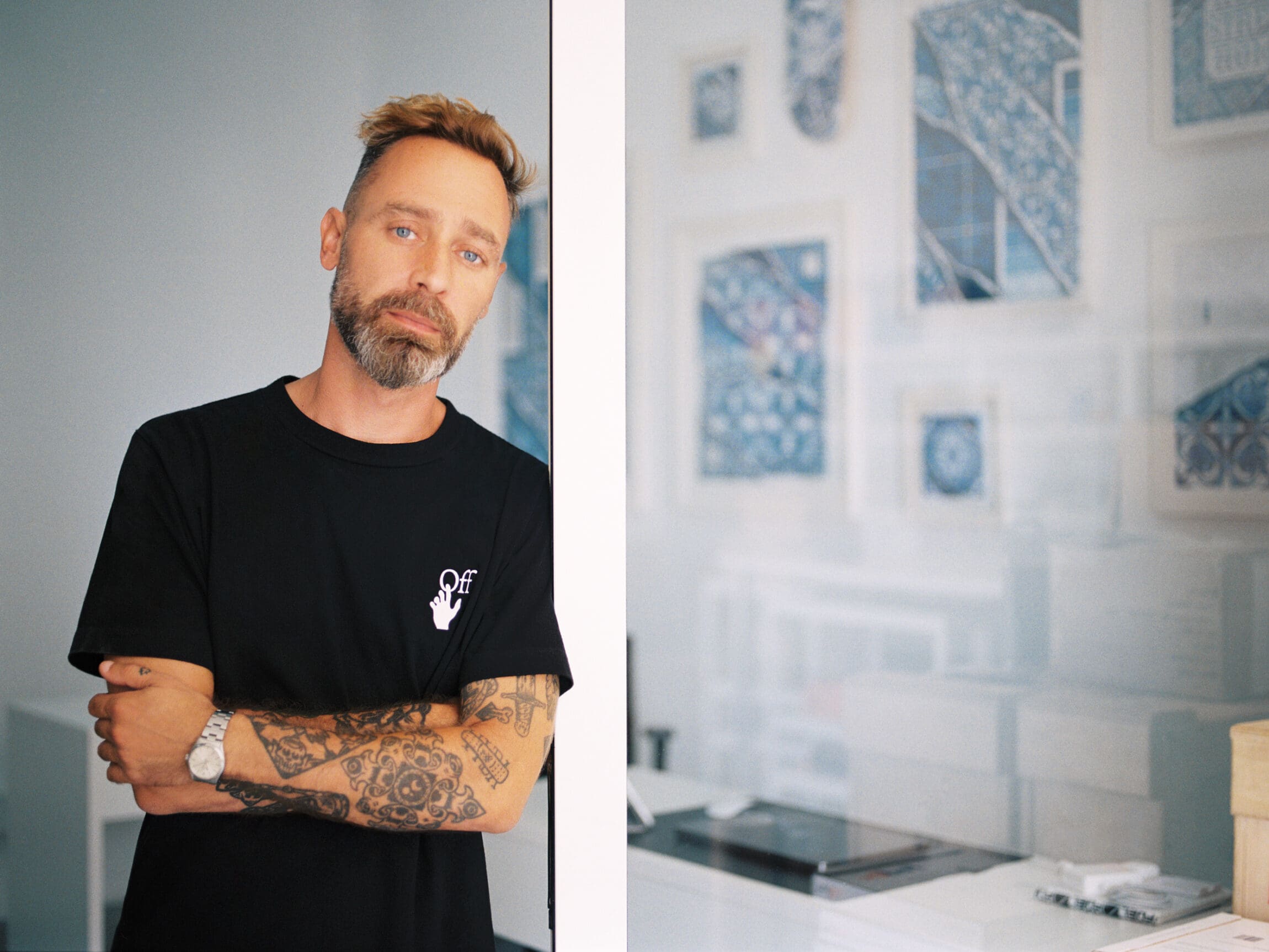 Diogo Machado, aka Add Fuel, on reinterpreting Portuguese azulejo tiles | Diogo Machado leaning against a door in his studio