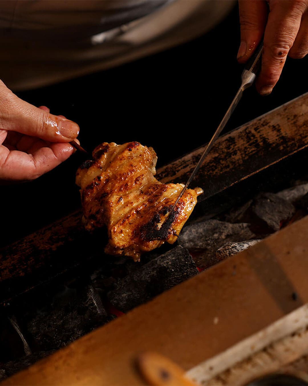 A perfectly grilled piece of chicken at Torishiki