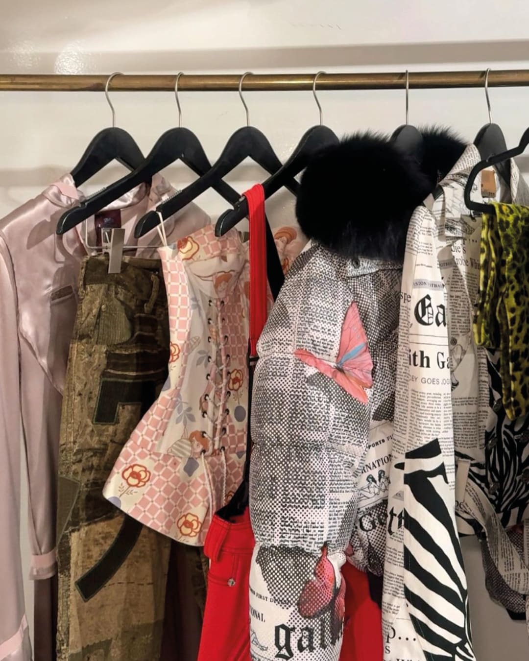 The best vintage stores in New York | a rail of flamboyant designs at What Comes Around Goes Around