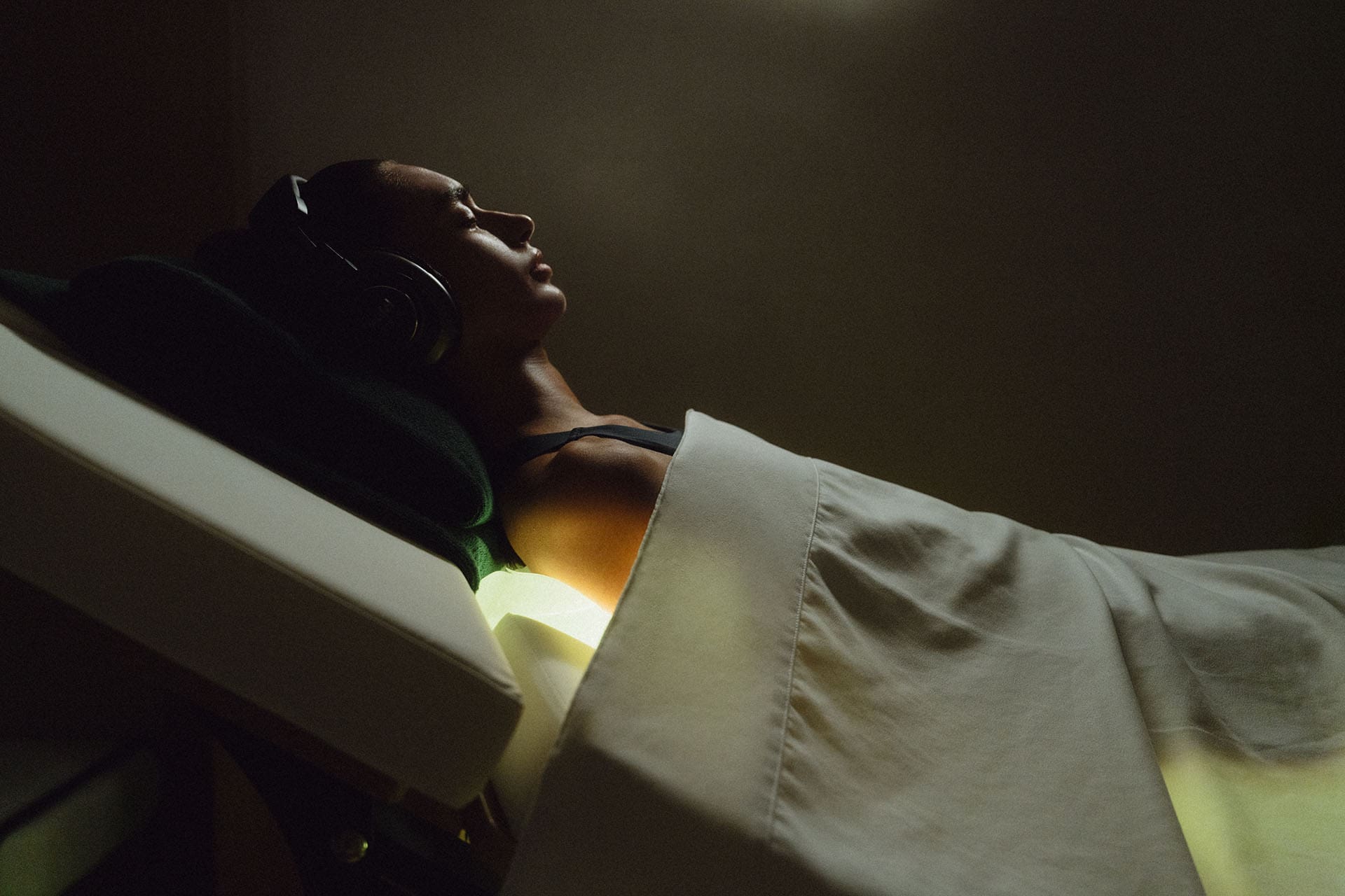Woman receiving light therapy, a hotel wellness treatment at Siro Dubai