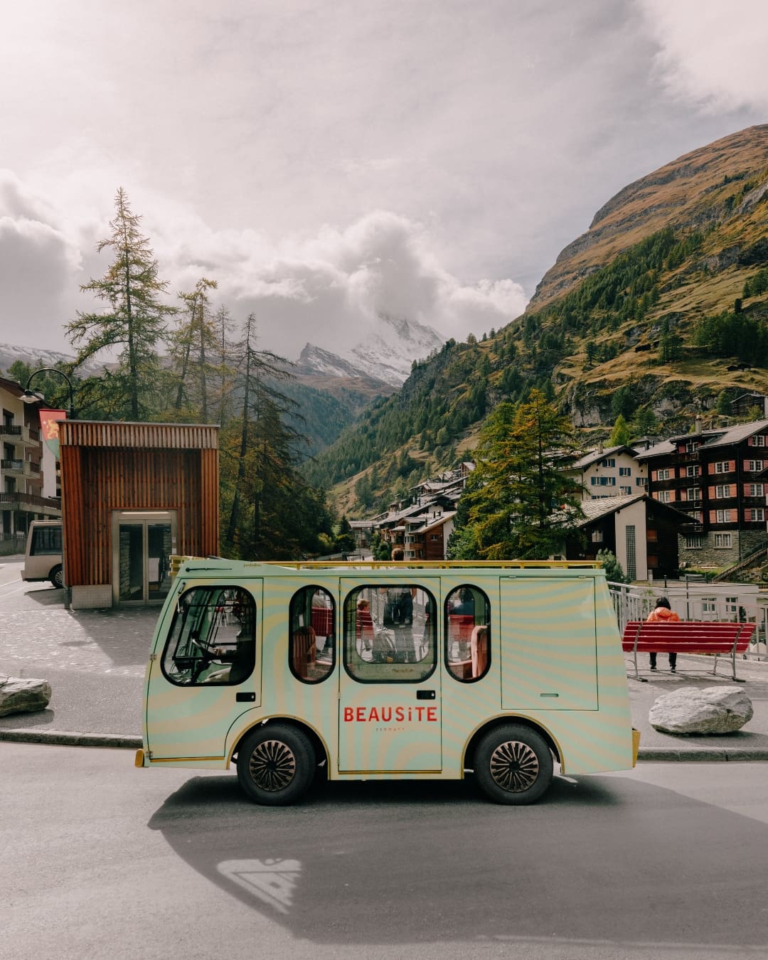 A sage green van beneath Matterhorn