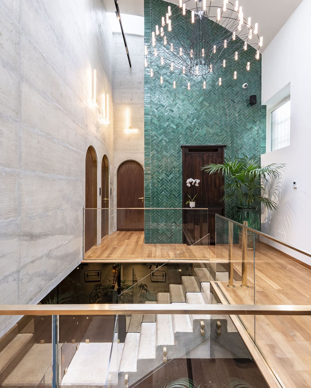 The entrance hall at Vico Milano hotel with a chandelier light above