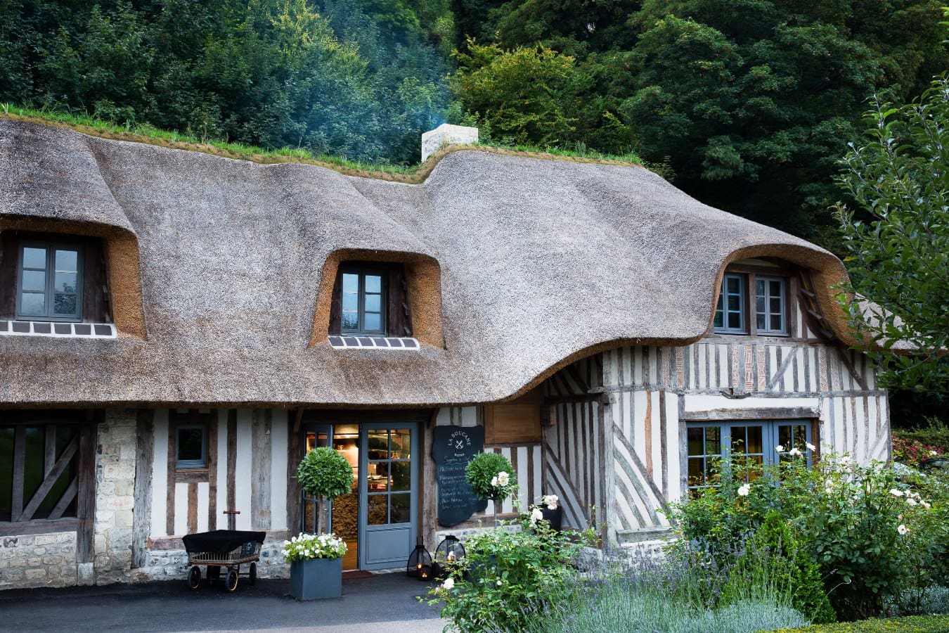 The thatched-roof bistro at La Ferme Saint-Siméon