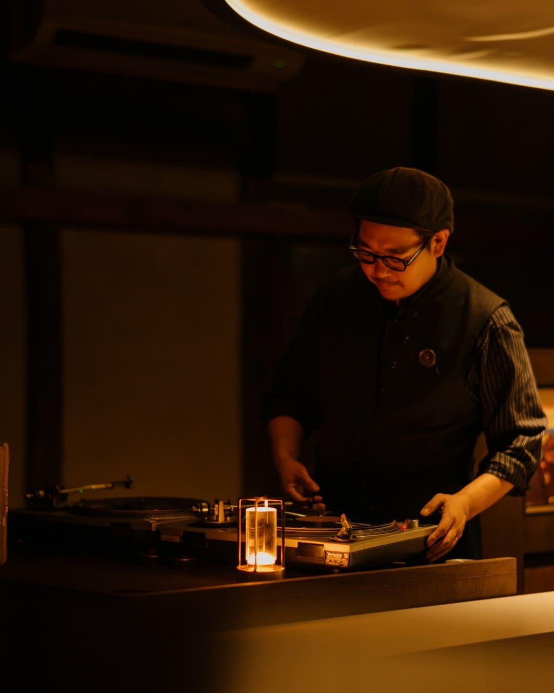 A man behind the decks at Thee Coffee