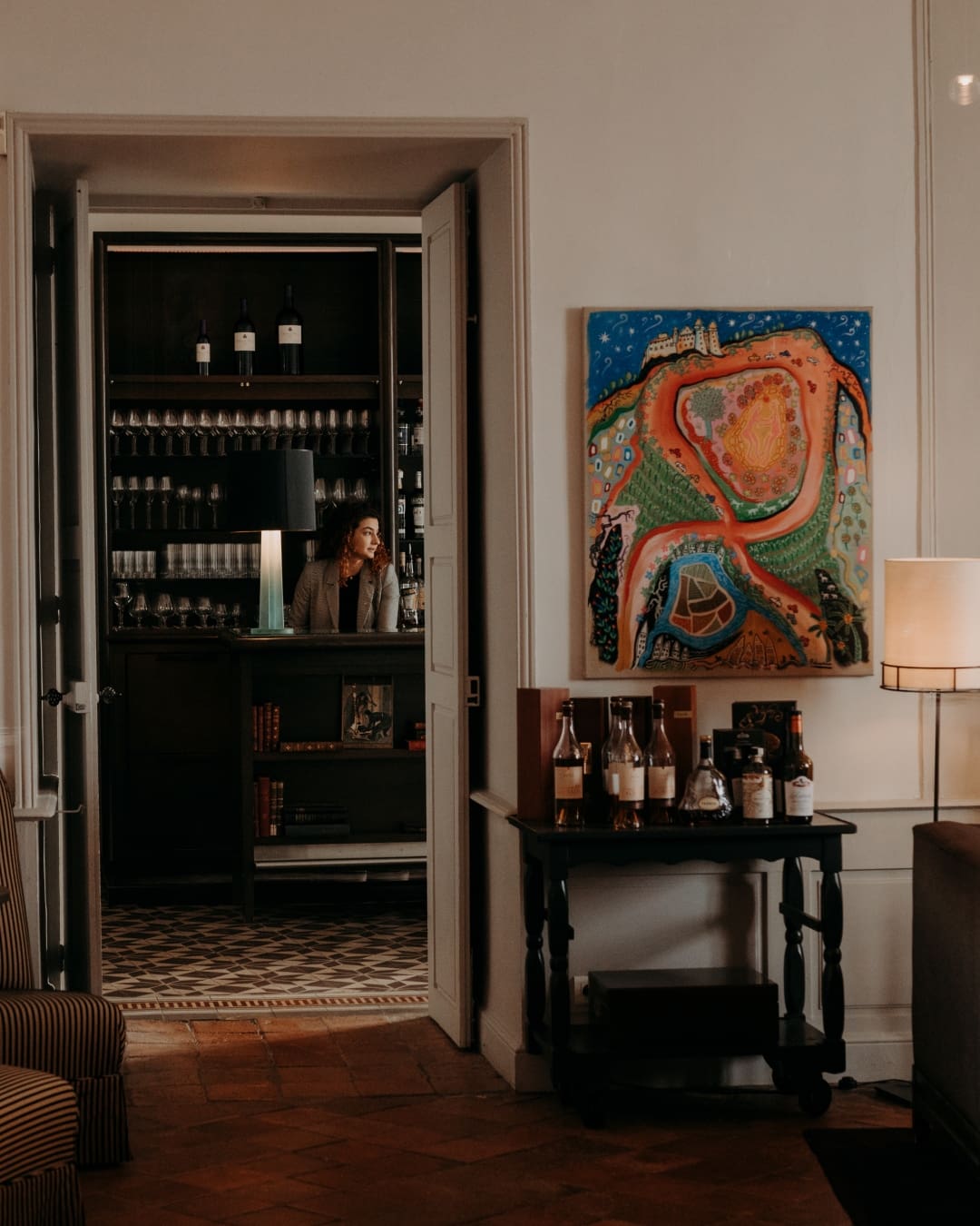 Contemporary art and a door looking into the bar at Château de Mercuès, Cahors