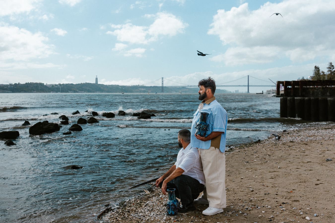 The founders of Oficina Marques stood on the beach, looking out to sea