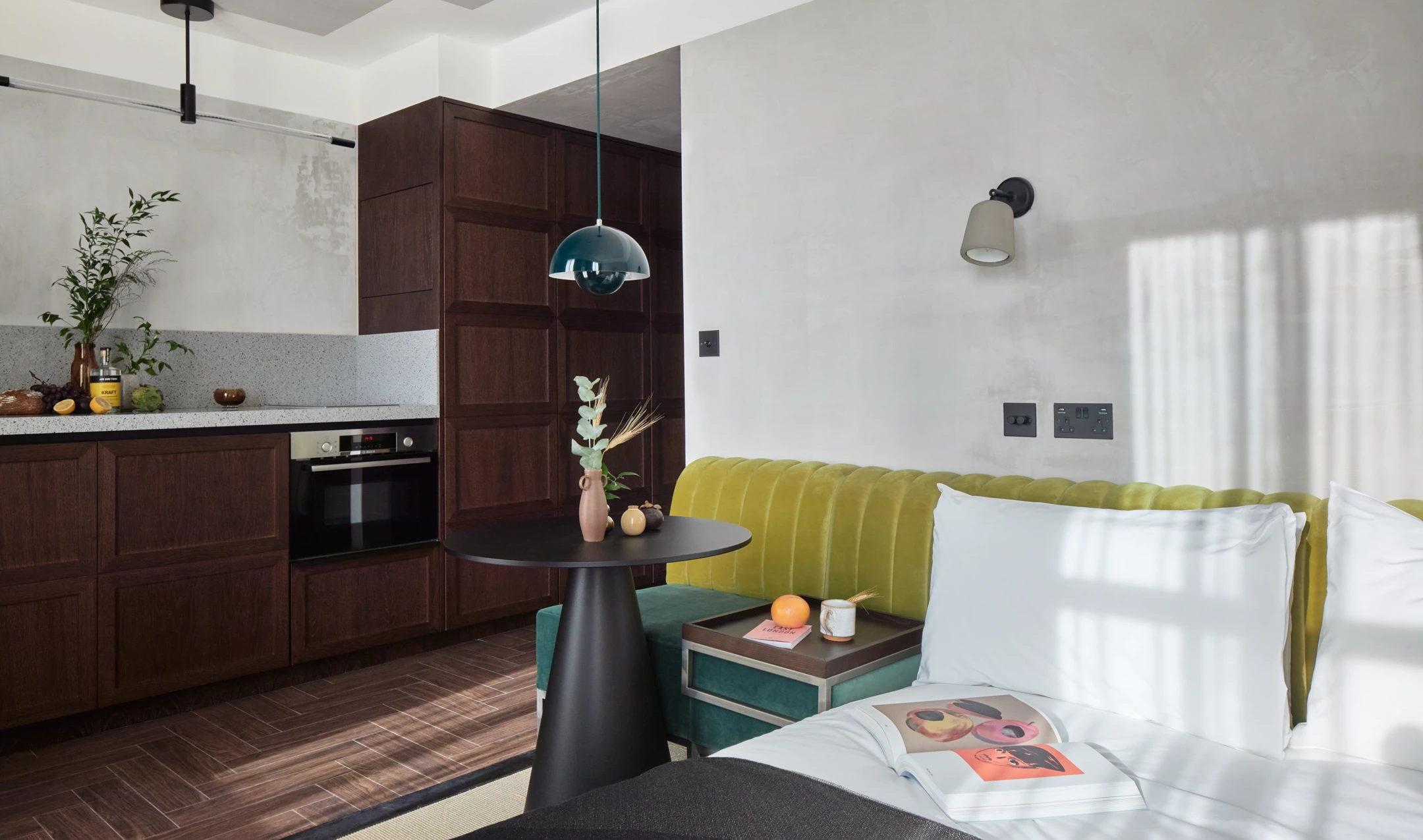 An apartment with a kitchenette and bed in view at StayCity Dalston