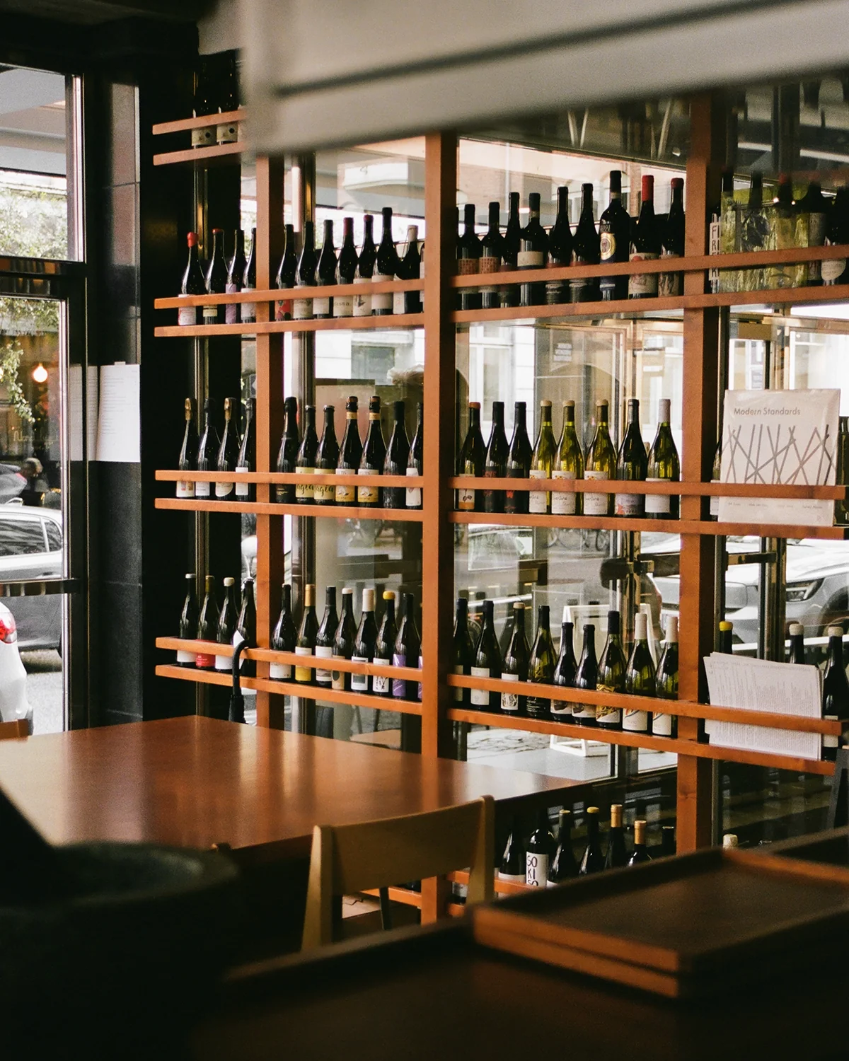 Wine bottles lined at Bar Vitrine. Courtesy of FRAMA.