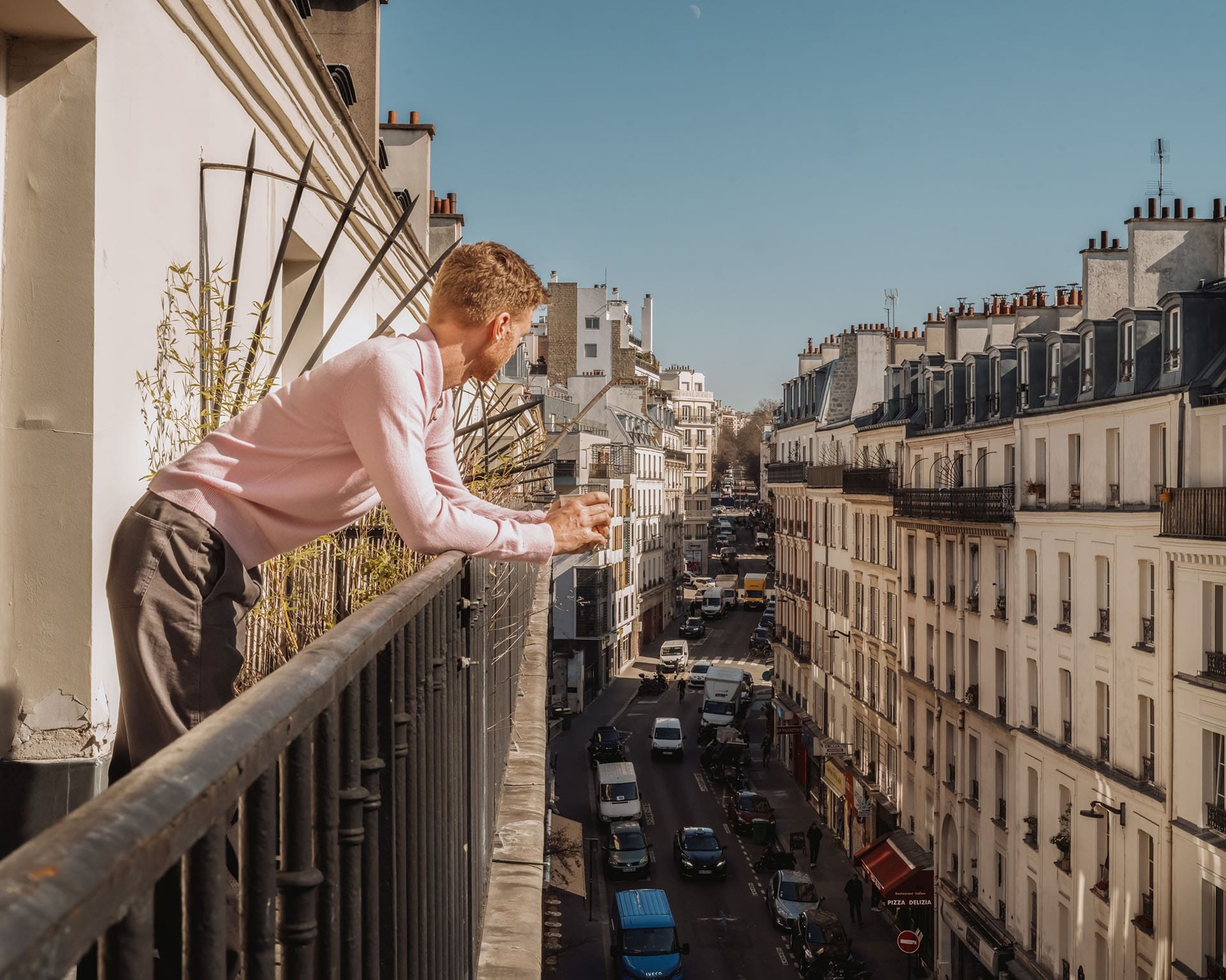 Jewellery designer Seb Brown looks out from his balcony in Paris.