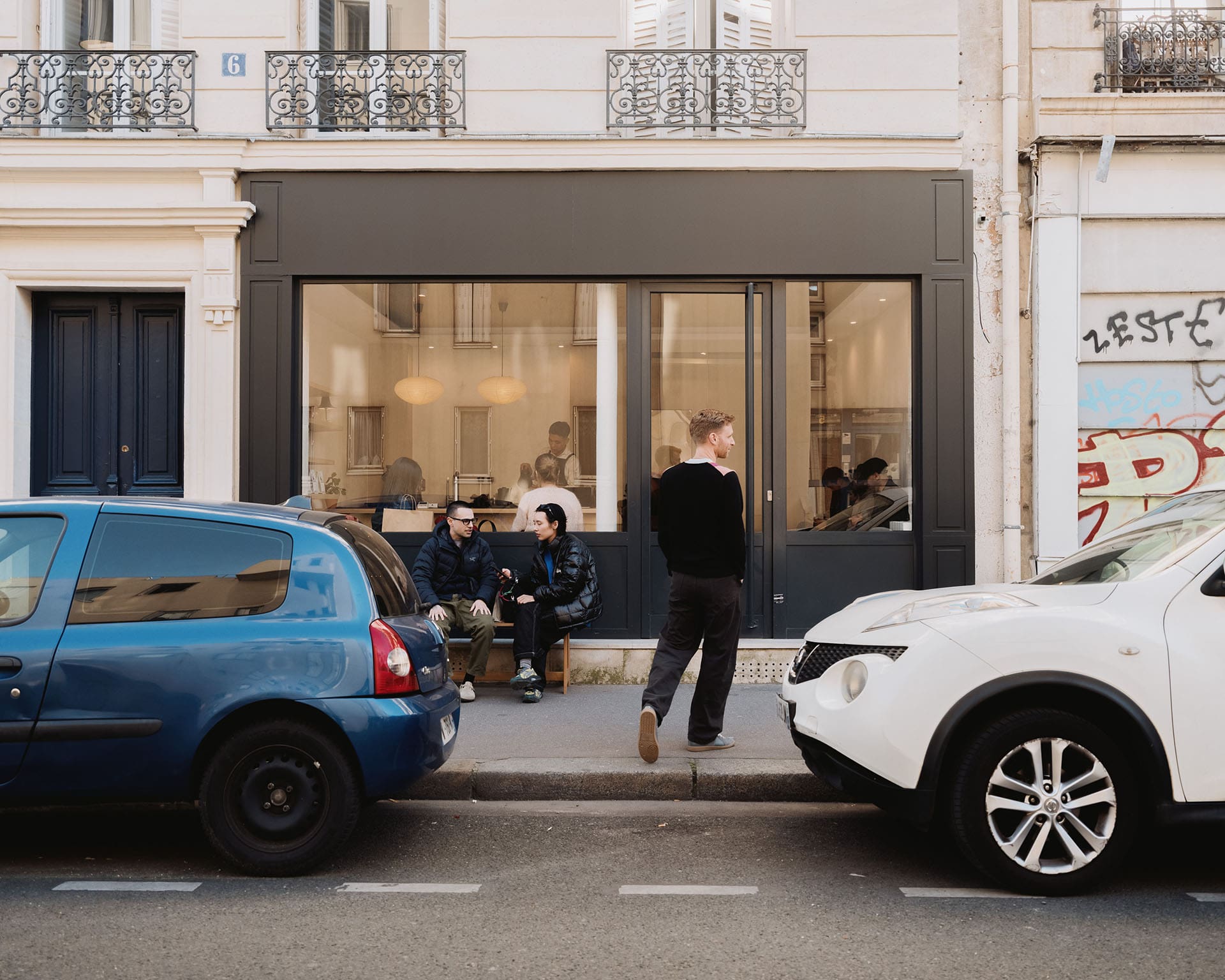 Jewellery designer Seb Brown outside a coffee shop in Paris. Photography by Alex Cretey Systermans