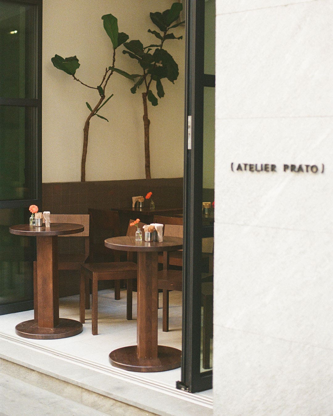 Two street-side tables at Atelier Prado