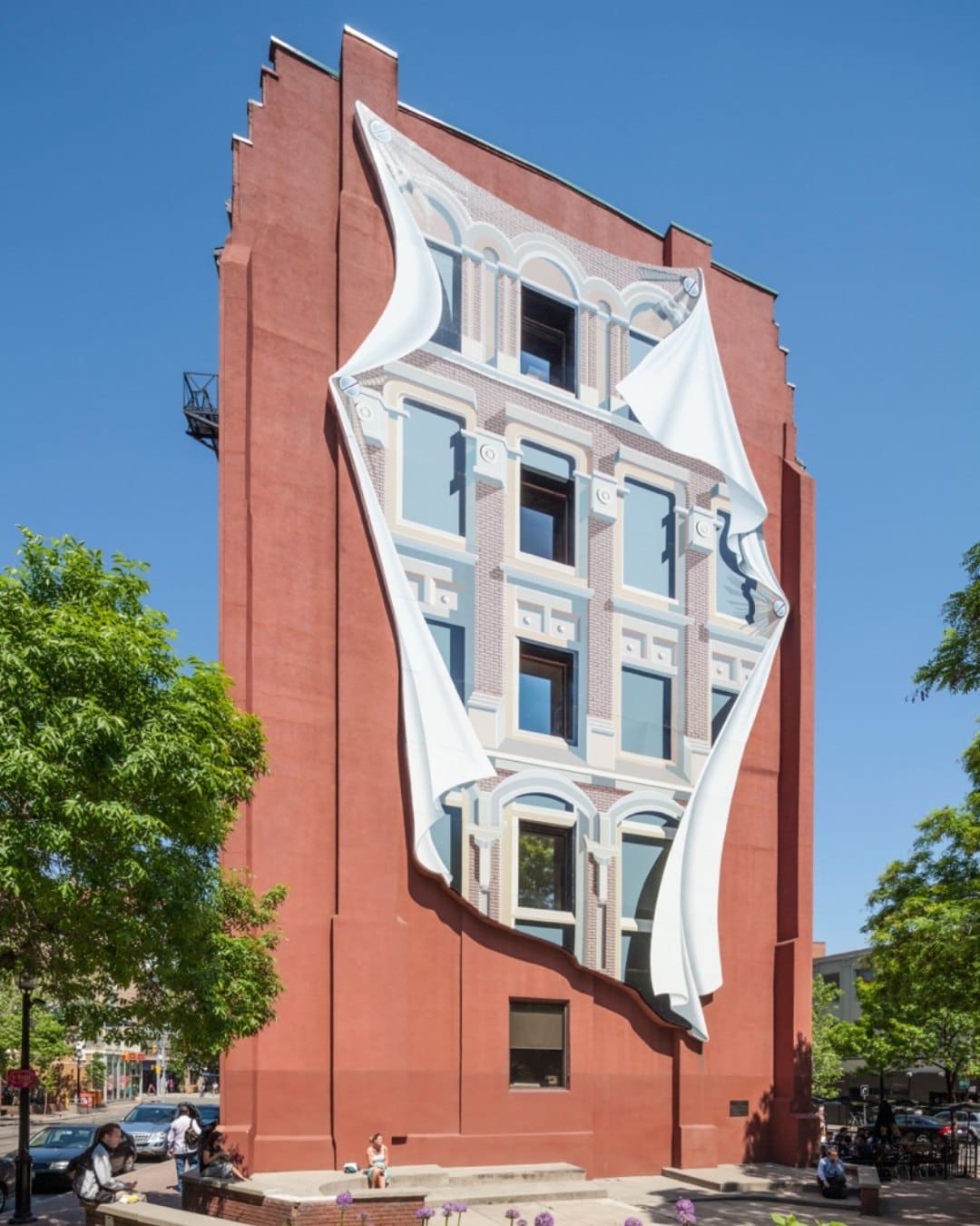 The Gooderham Building featuring a mural by Derek Michael Besant. Photography by Nikreates / Alamy